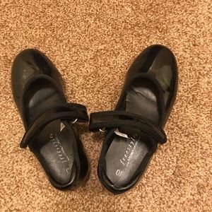 Little girl tap dancing shoes